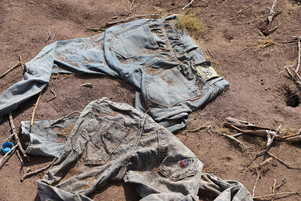 Clothes thought to be discarded by migrants lie in the Djibouti desert.