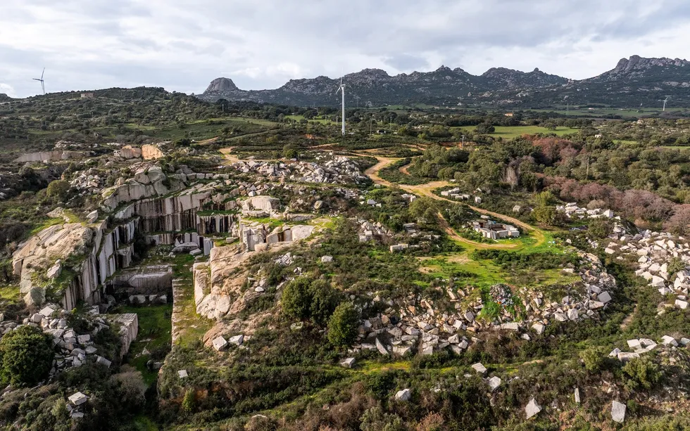 Bucolic scene with the remains of an old quarry, now covered partially in vegetation 