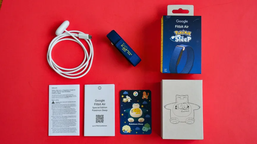The full spread of items when you unbox the Fitbit Air Pokemon Sleep edition.