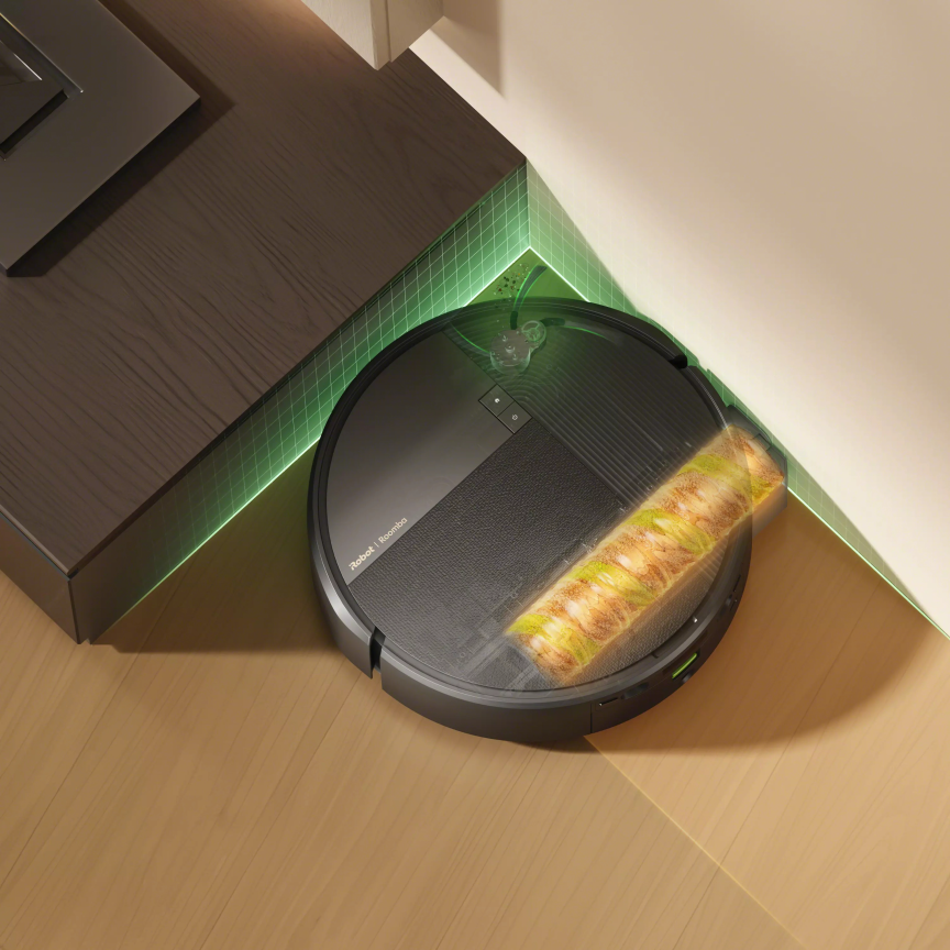 Max 875 cleaning corners with its roller mop.