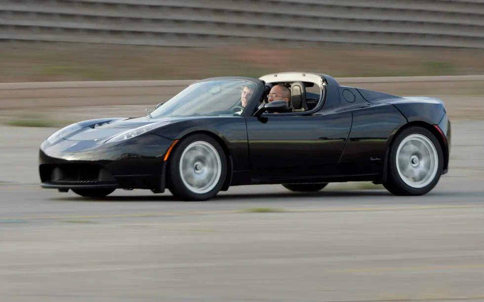A black two-seat roadster. 